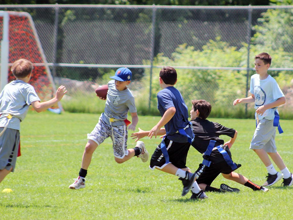 Flag football at summer sports camp