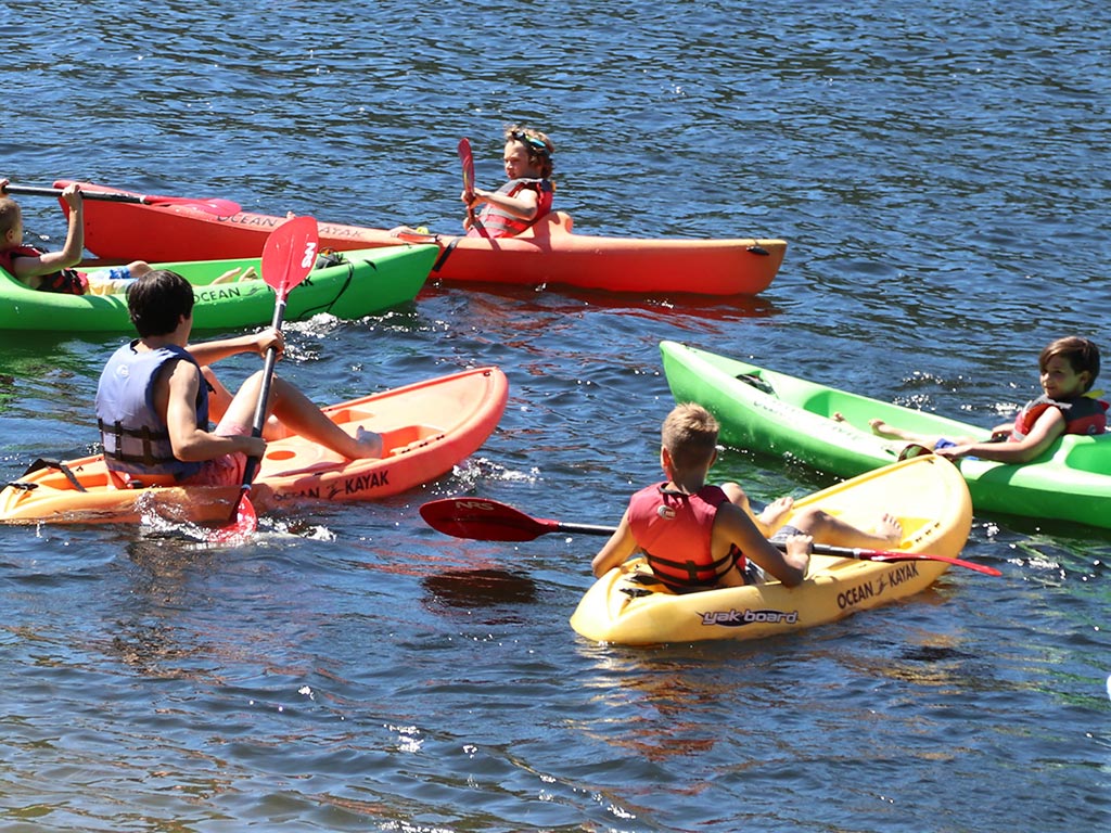 Kayaking on the lake at boys sleepaway camp