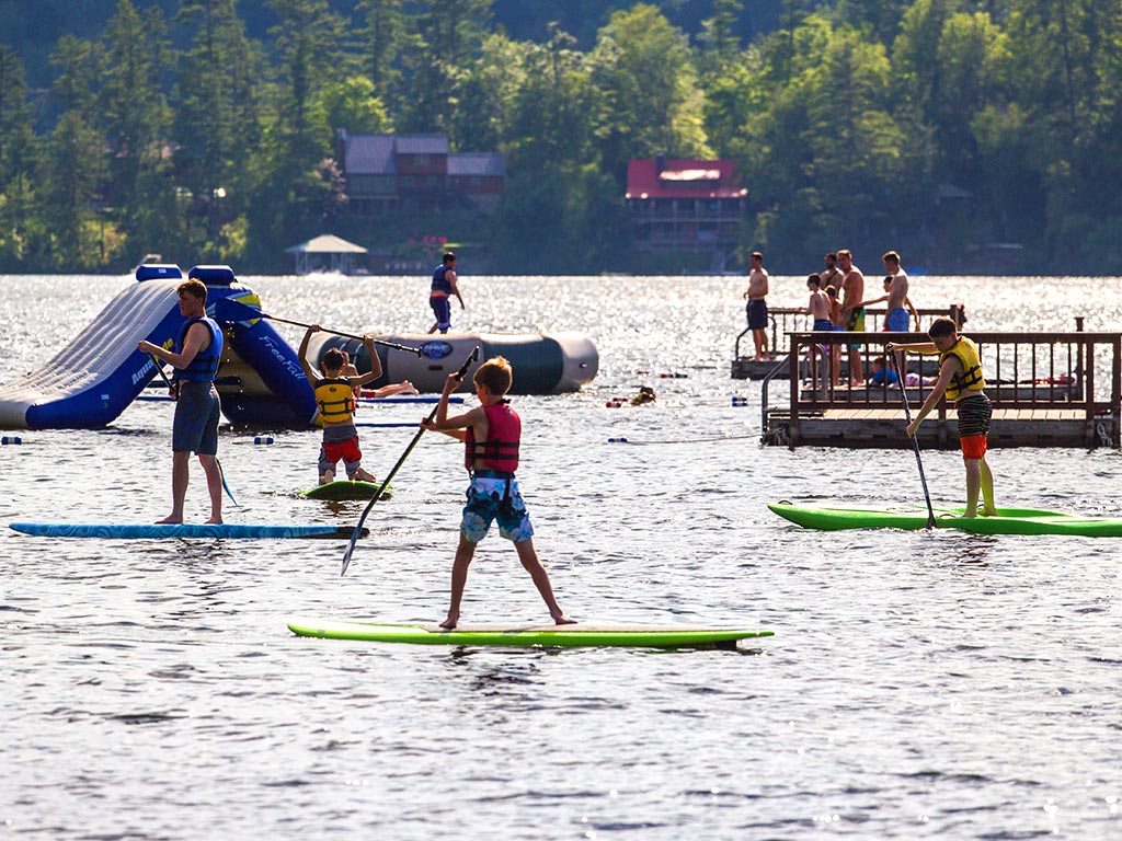 Stand up paddleboarding at summer camp